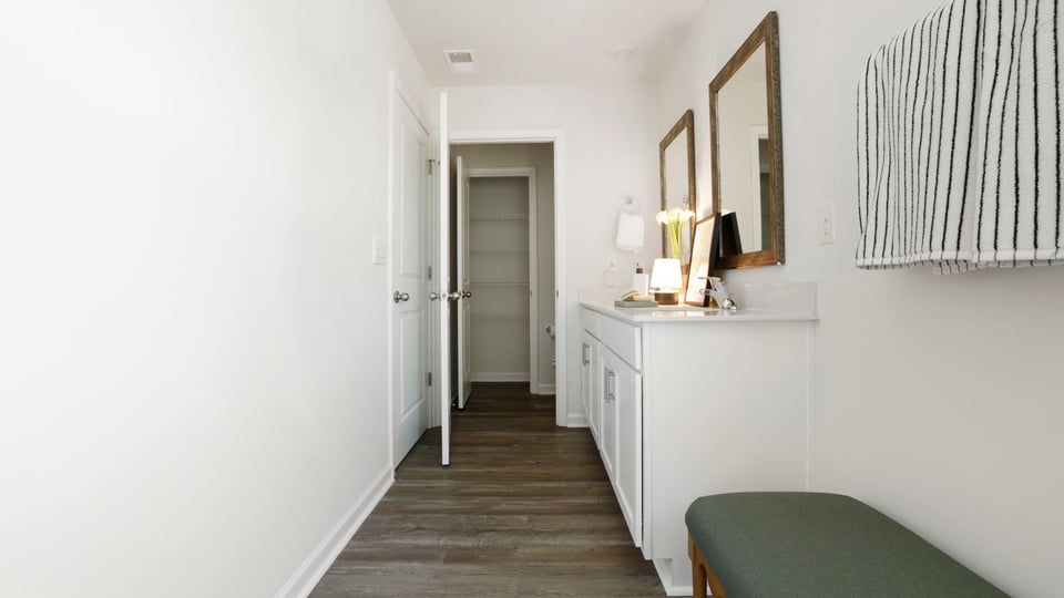 Bathroom with walk in closet.