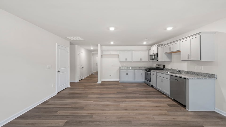 Kitchen with granite countertops.