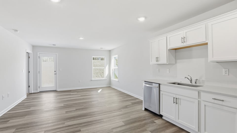 Kitchen with granite counter tops and stainless steel appliances.