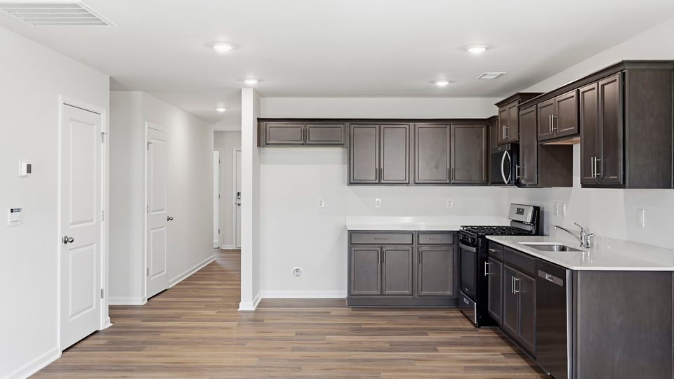 Kitchen with island and cabinets.
