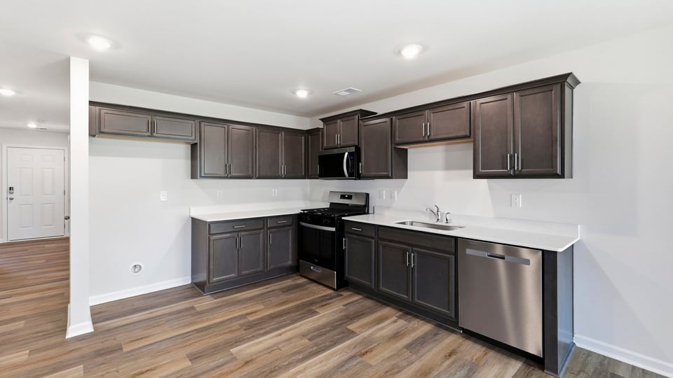 Kitchen with island and cabinets.