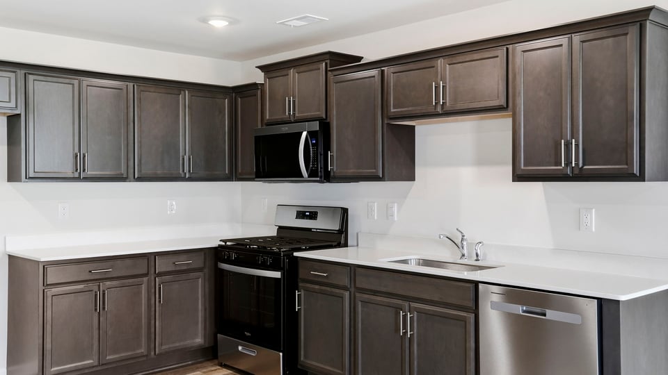 Kitchen with island and cabinets.