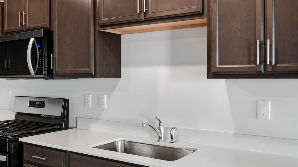 Kitchen with island and cabinets.