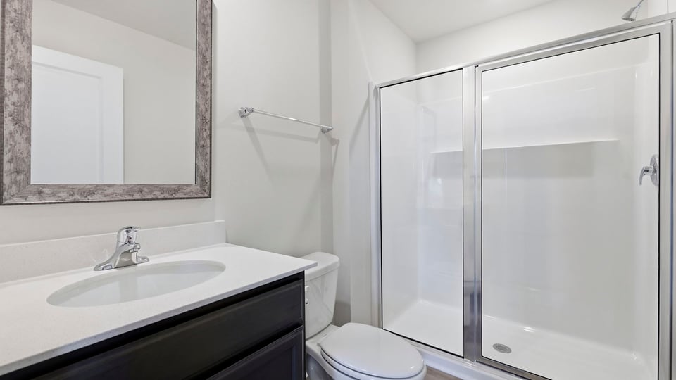 Primary bathroom with double vanity sinks.