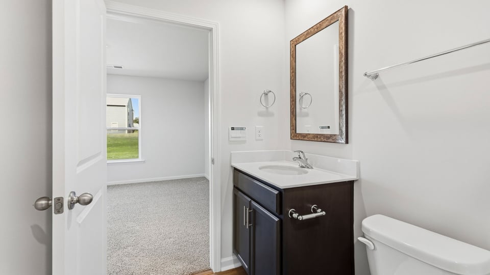Primary bathroom with double vanity sinks.