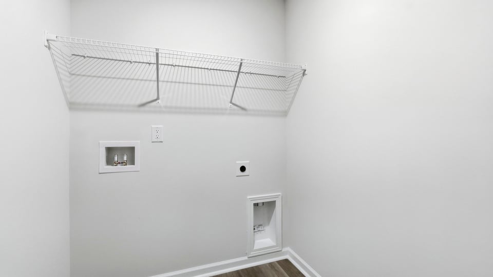 Laundry room with shelf.