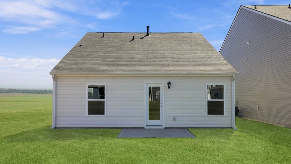 Back exterior with large backyard.
