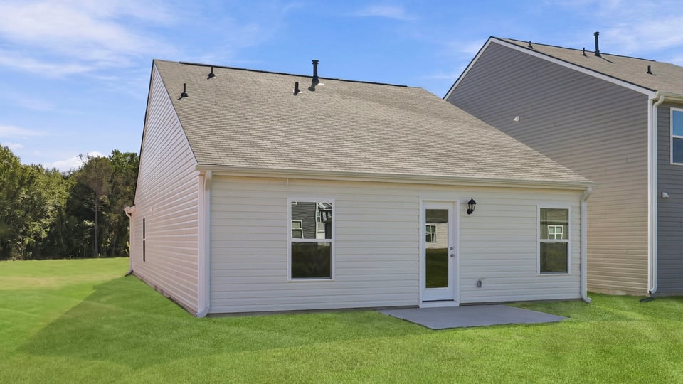 Back exterior with large backyard.