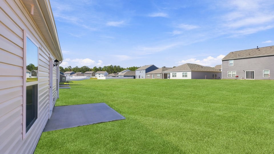 Back exterior with large backyard.