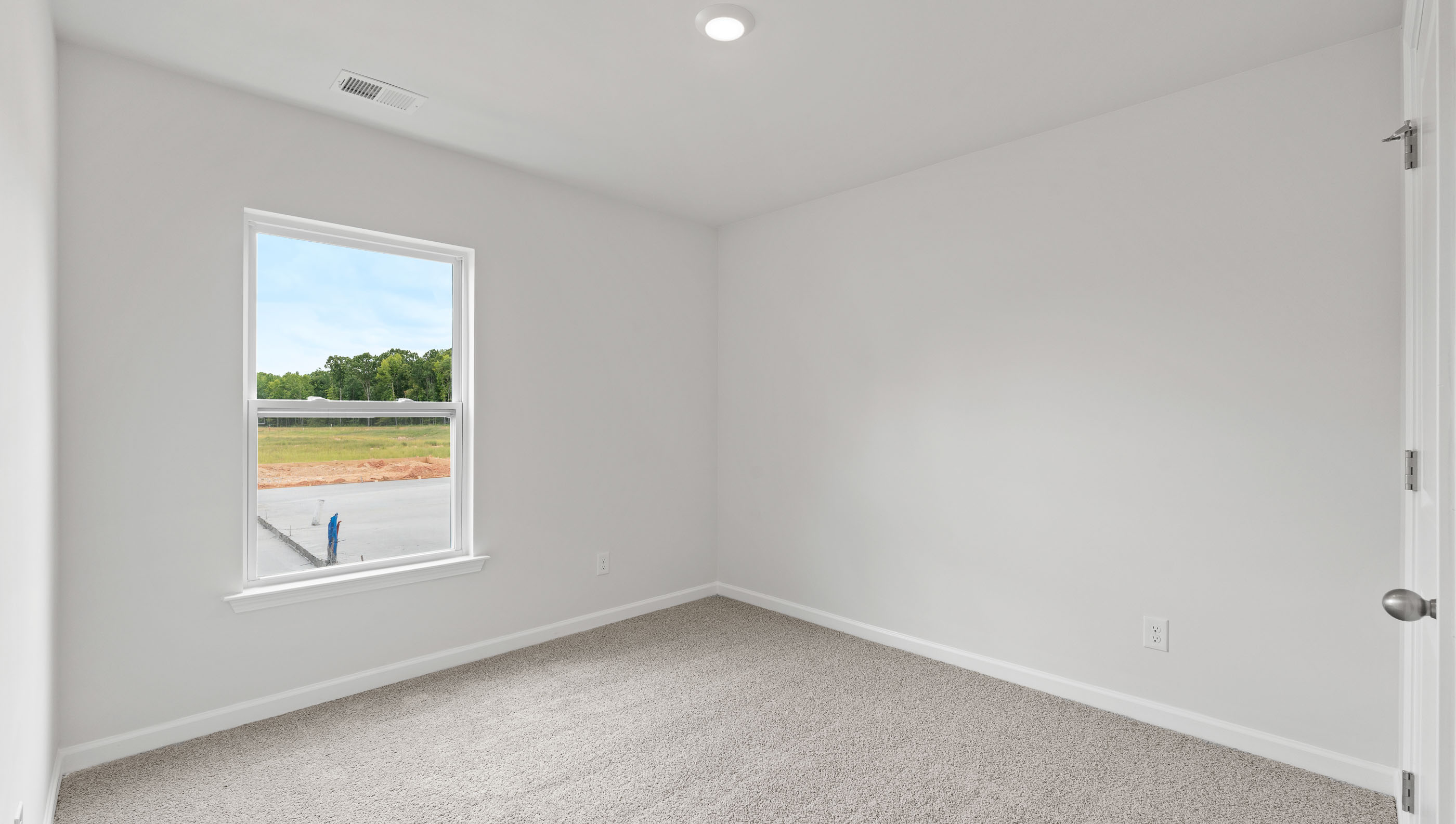 Bedroom 2 with carpet and window.