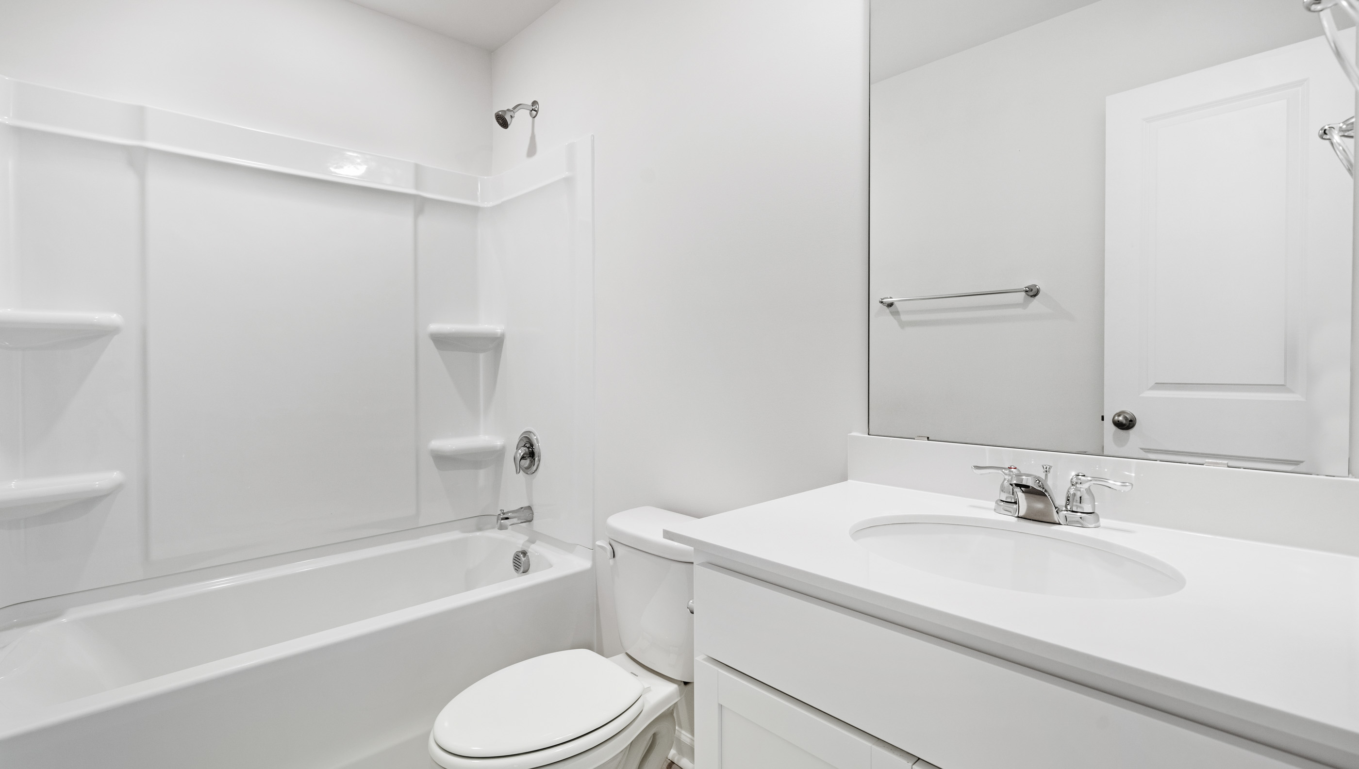 Bathroom with vanity and tub.