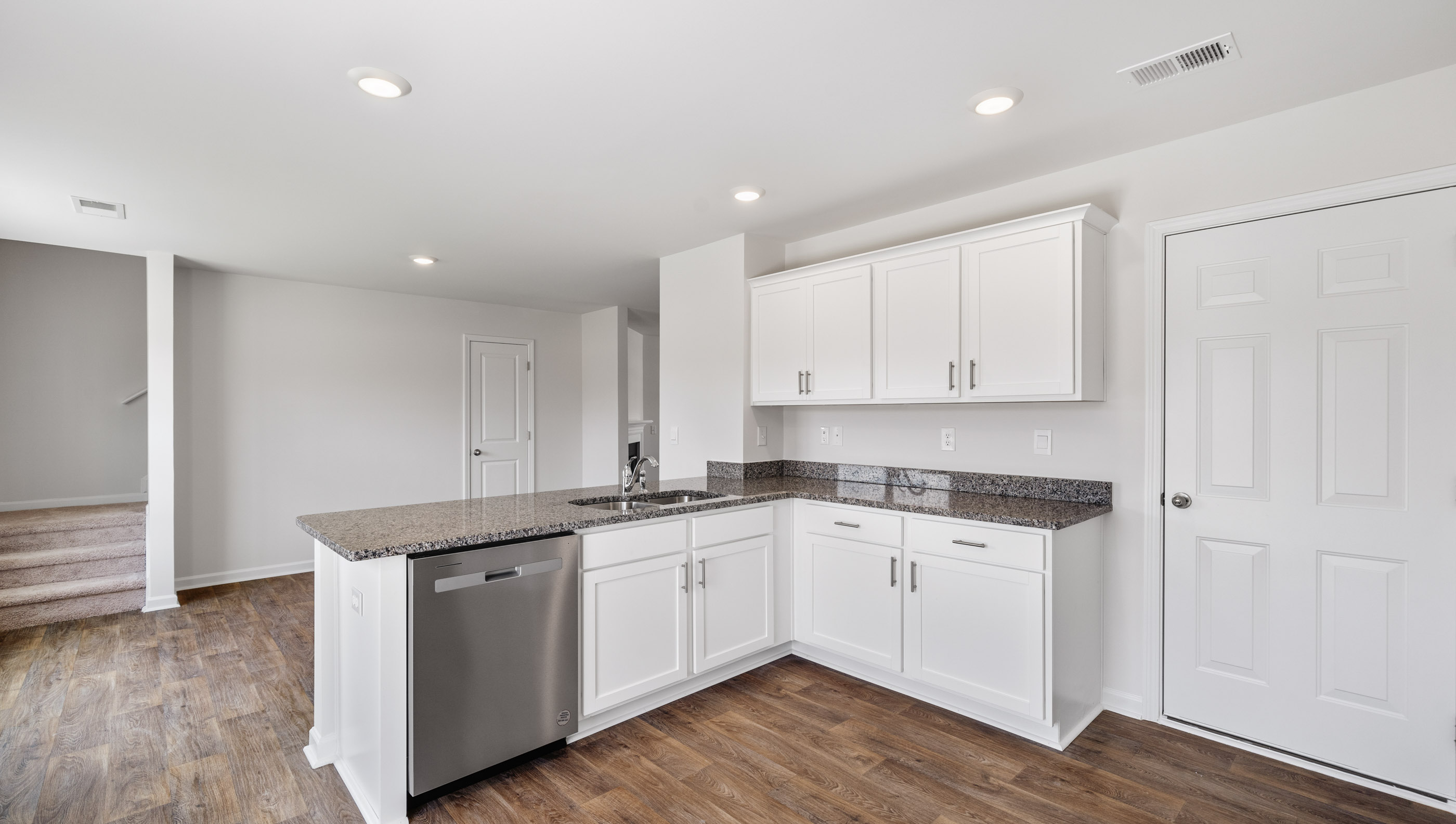 View of kitchen with cabinets and Stainless steel appliances.