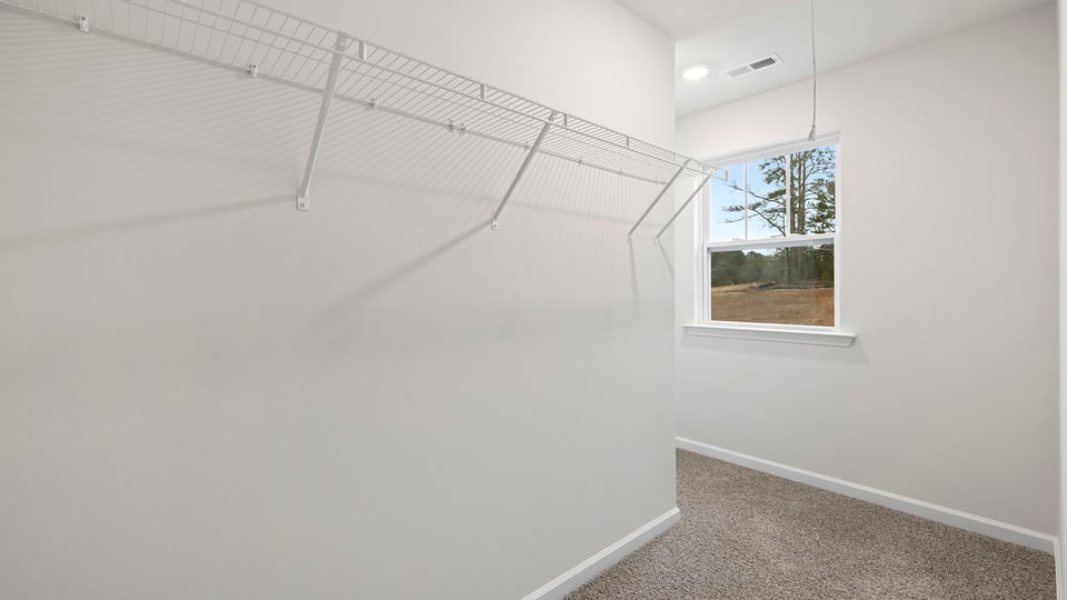 Primary bedroom walk-in closet.