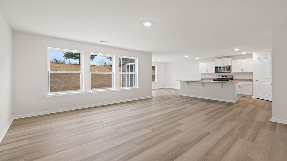 View of living area and kitchen.