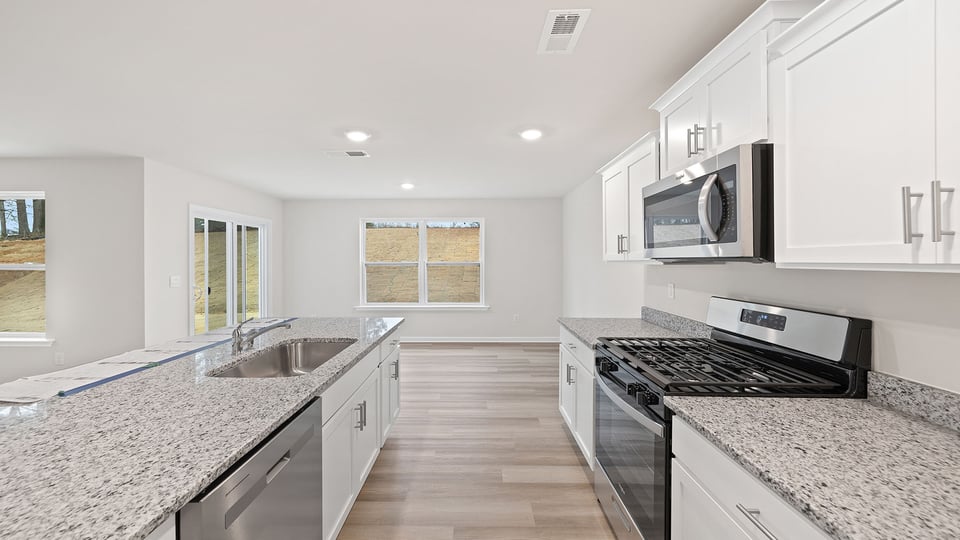 Kitchen island and countertops are quartz.