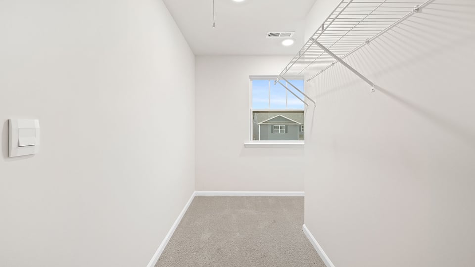 Primary bedroom walk-in closet.