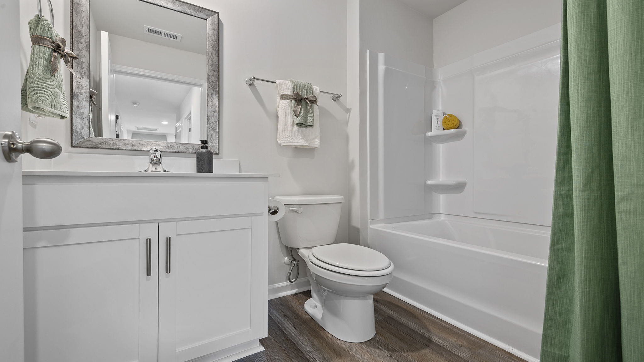 Hall bathroom with vanity and shower / tub.
