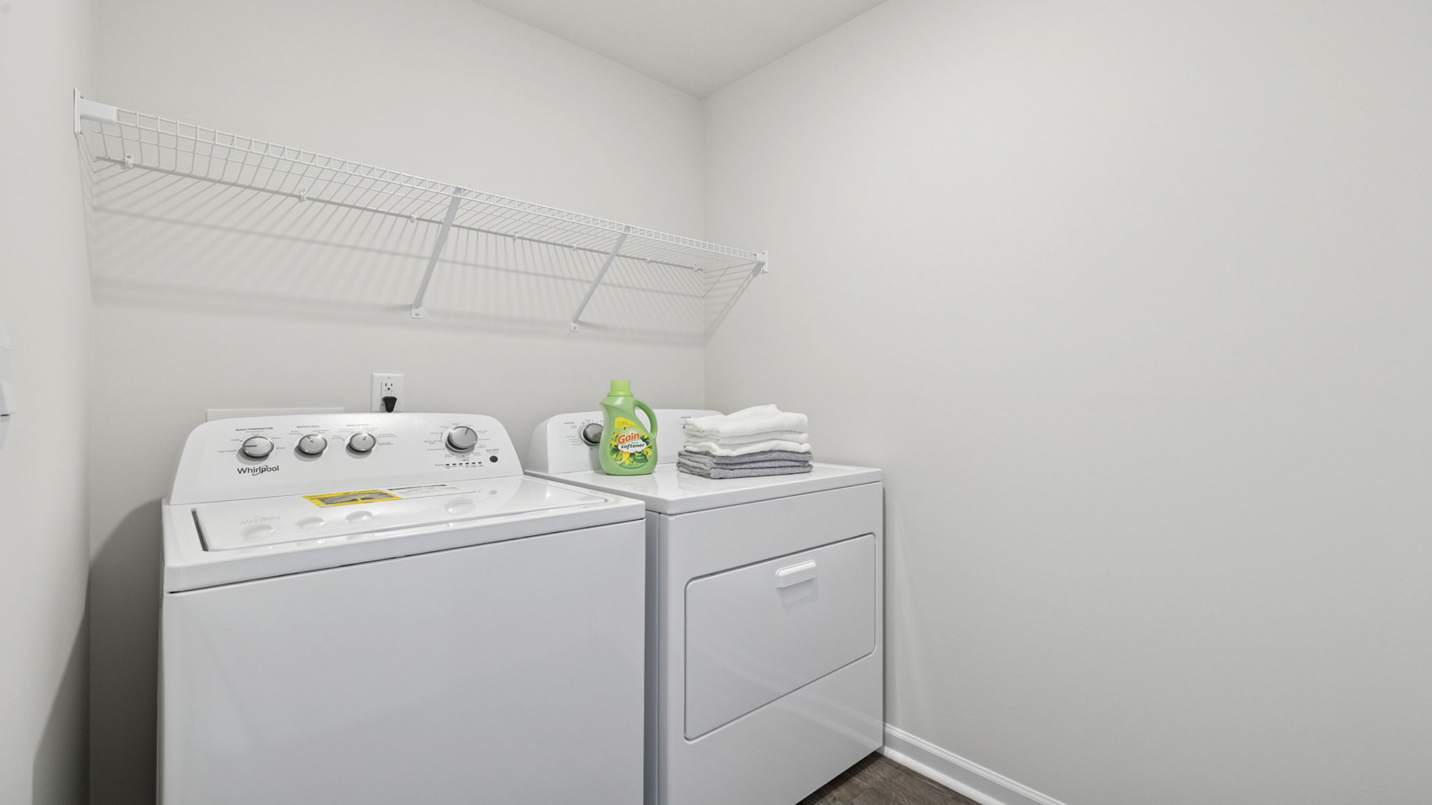Laundry room with wire shelving.