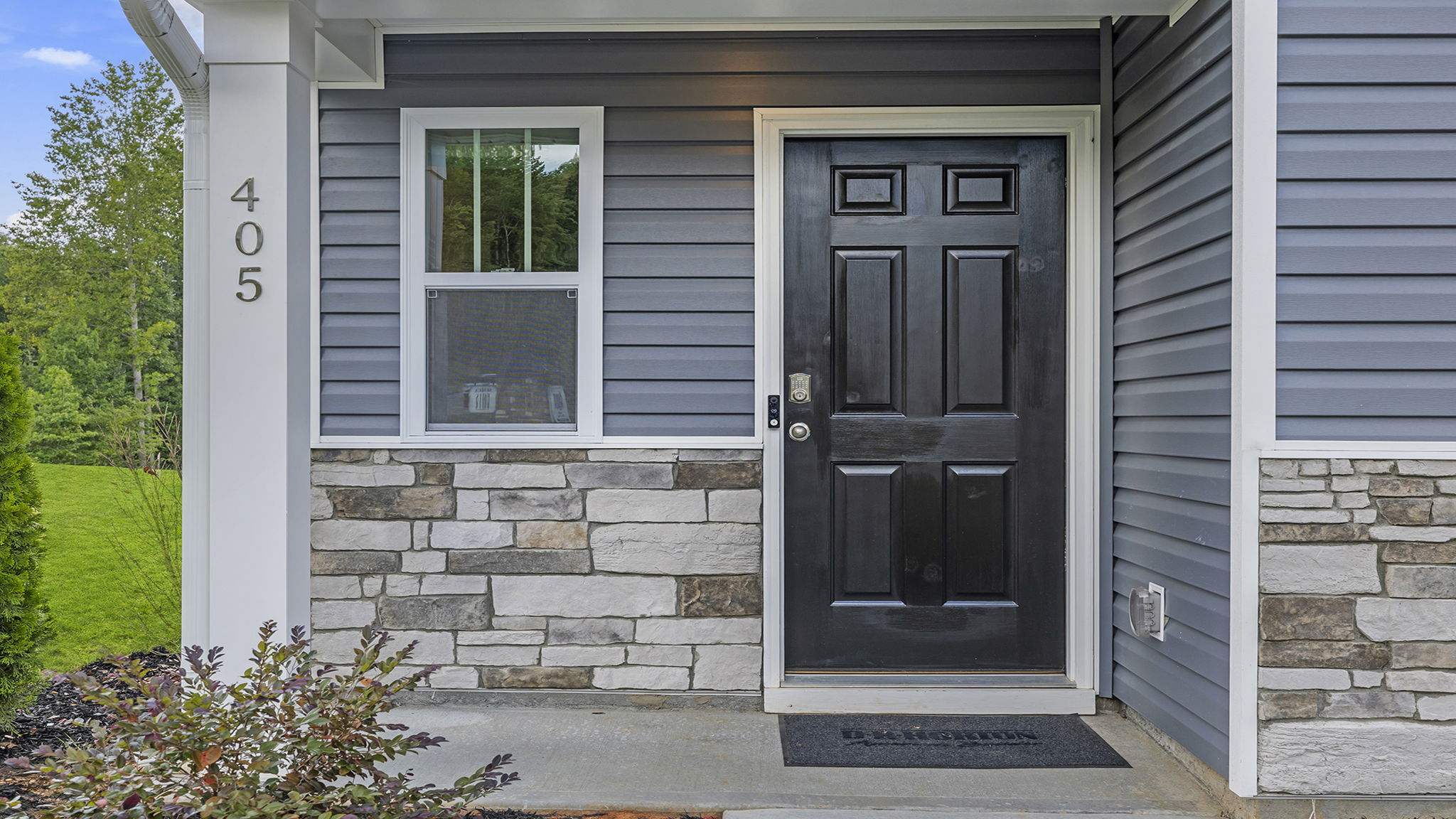 Entrance with stone accents.