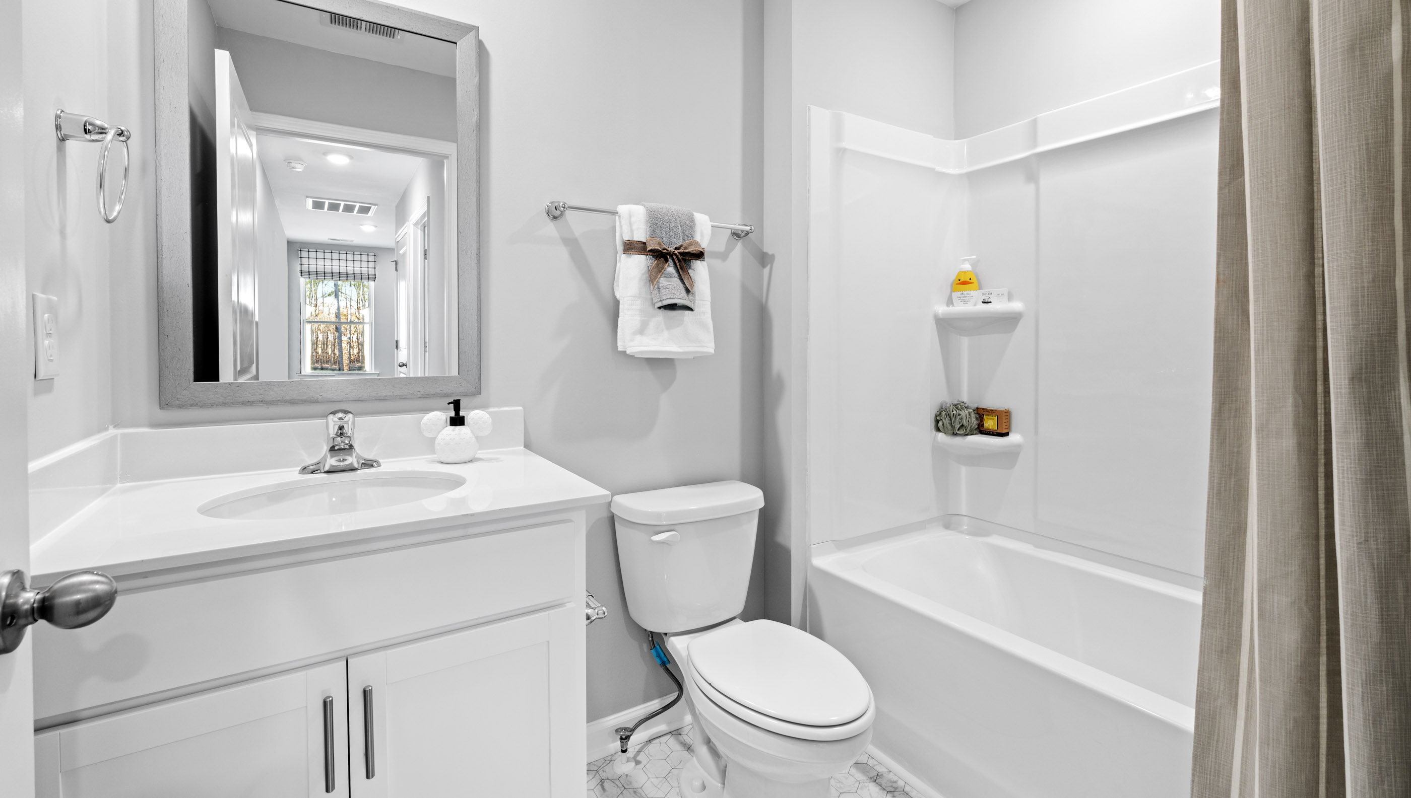 Bathroom with vanity and tub.