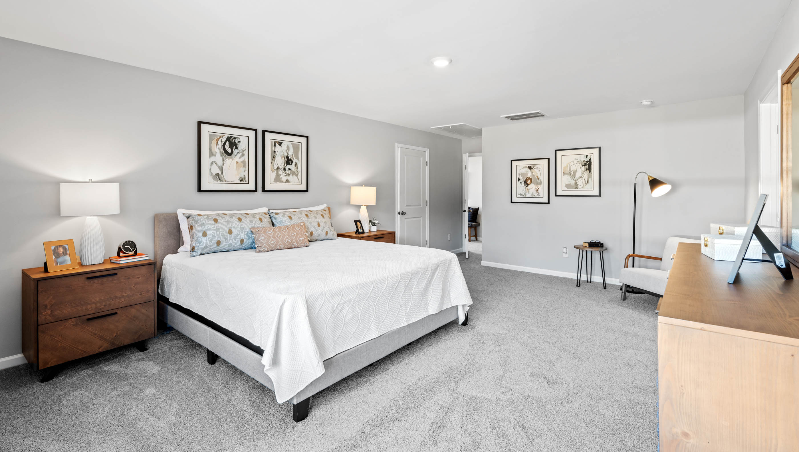 Large primary bedroom with carpet.