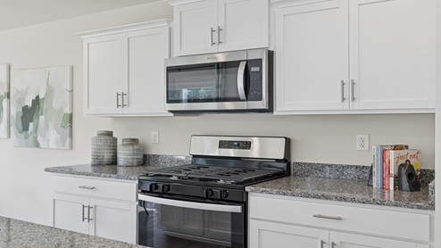 Kitchen with cabinets and island.
