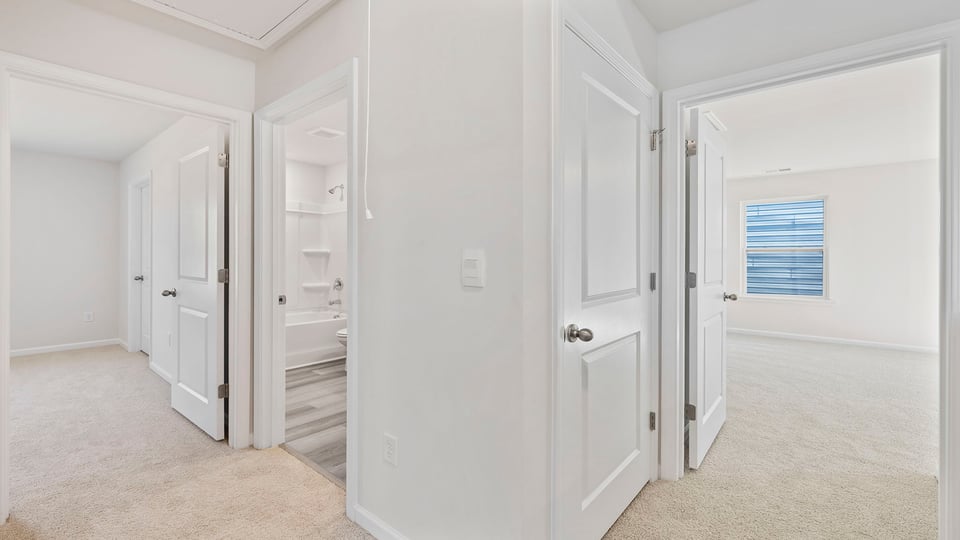 Bedroom with window and carpet.