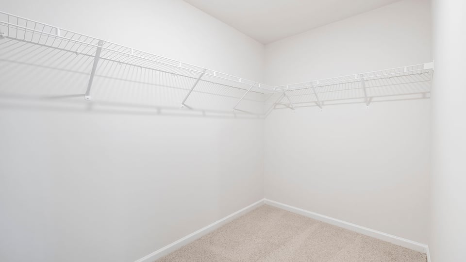 Primary bedroom walk-in closet.