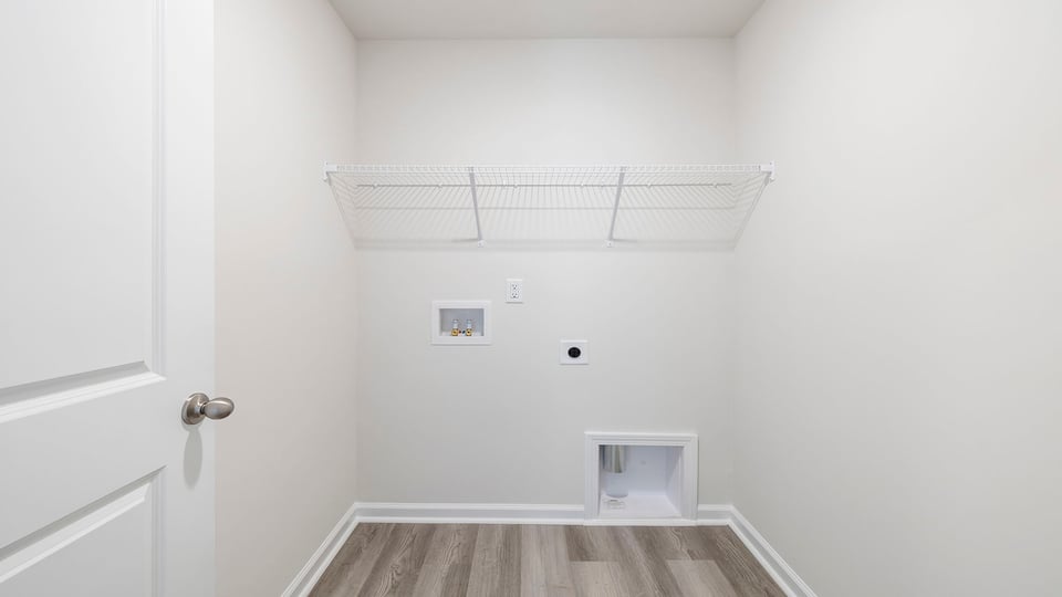 Laundry room with shelving.