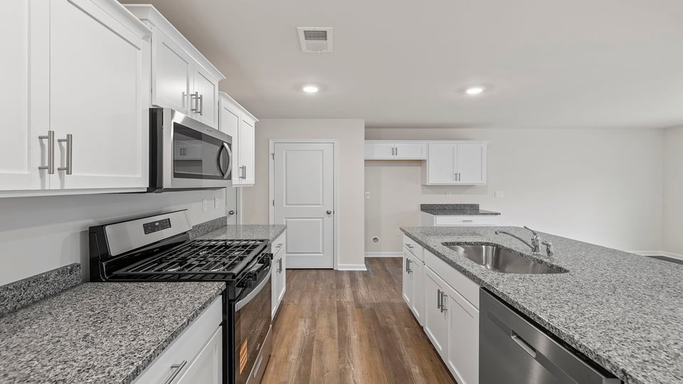 Kitchen with large island and wiindows.