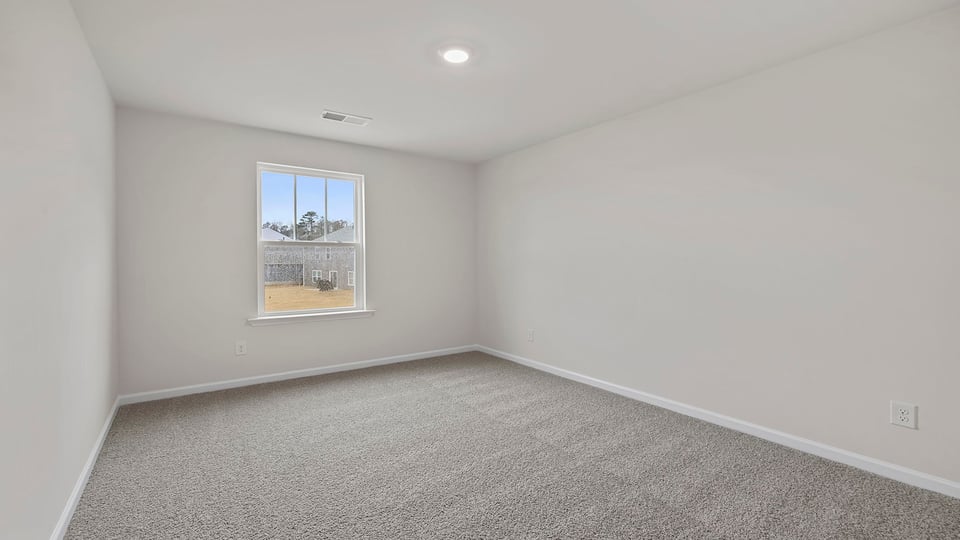 Bedroom with large windows.