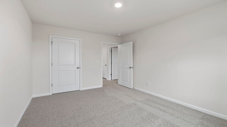 Bedroom with large windows.