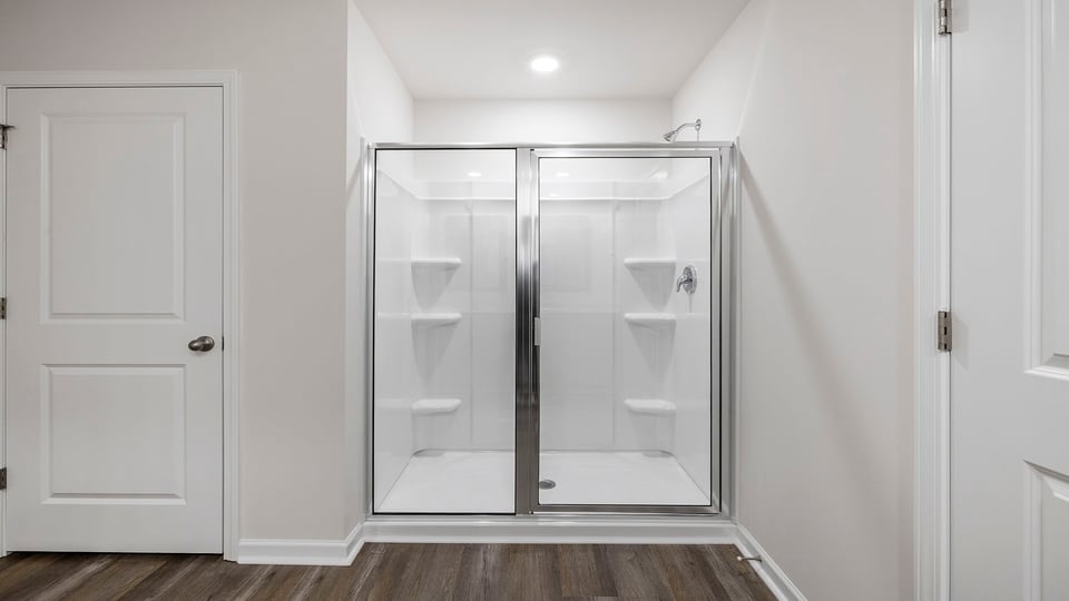Bathroom with vanity and walk in shower.