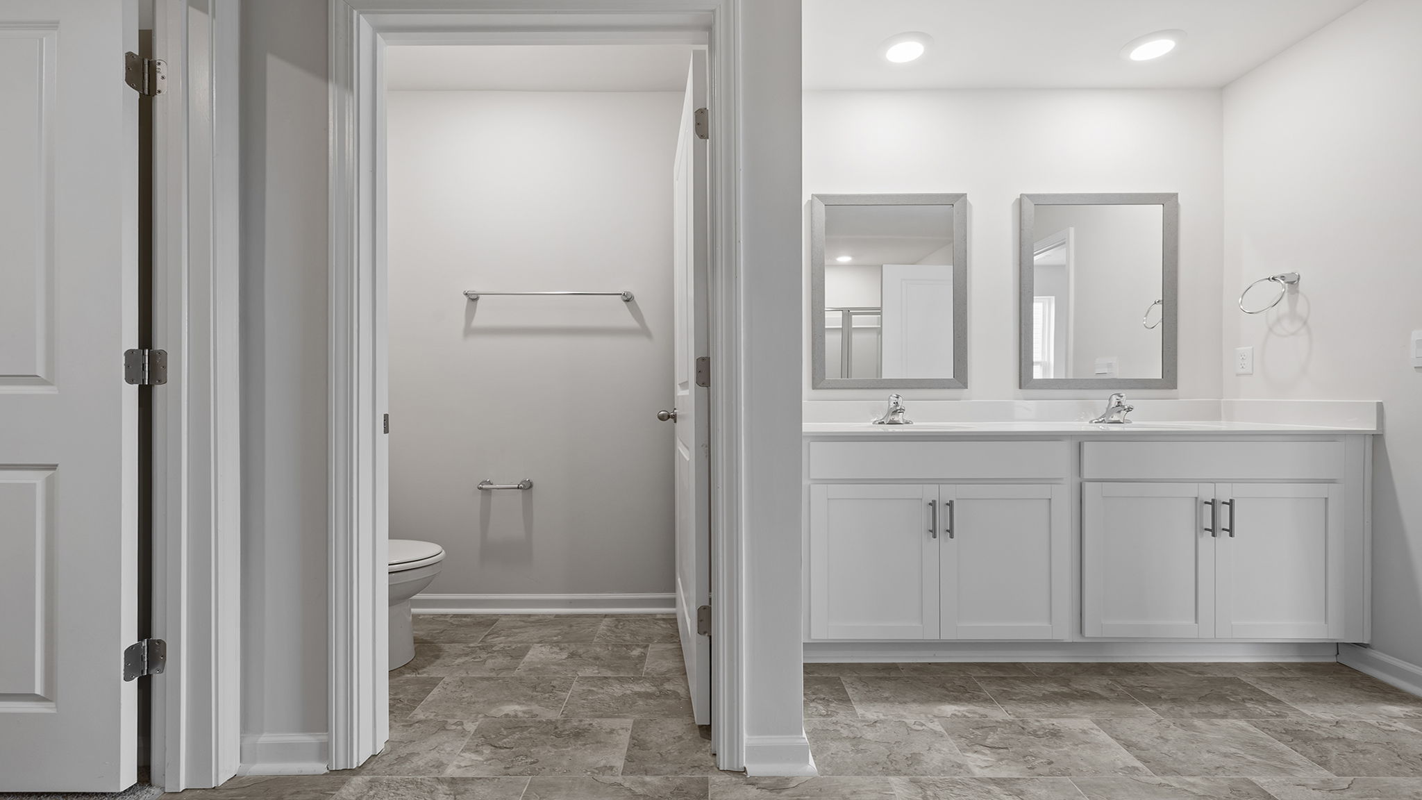 Primary bathroom with double vanity sinks.