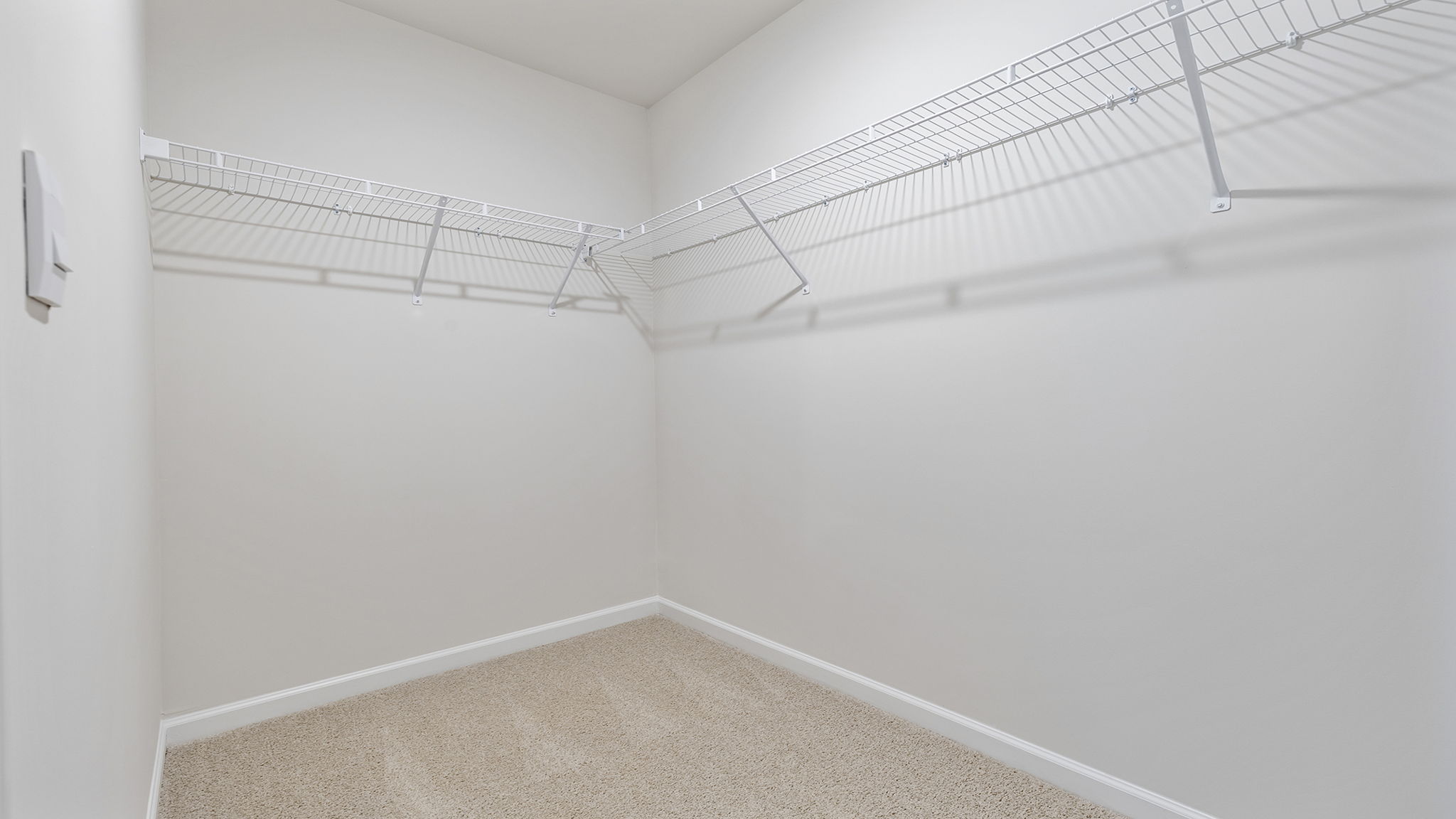 Primary closet with shelf.