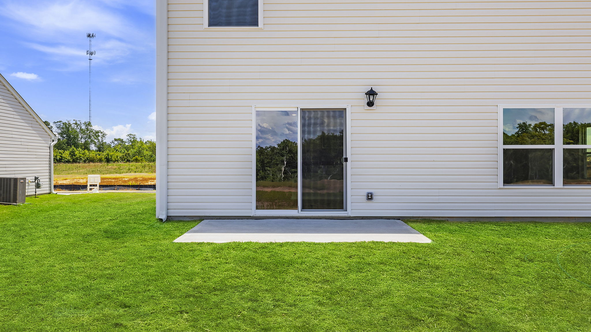 Back exterior with large backyard.