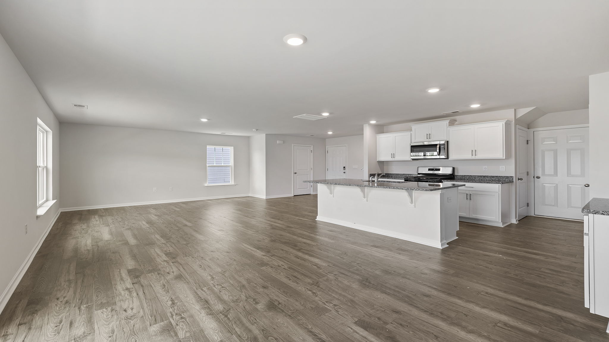 Open floor plan with lots of windows.