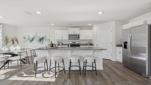 Kitchen with cabinets and island.