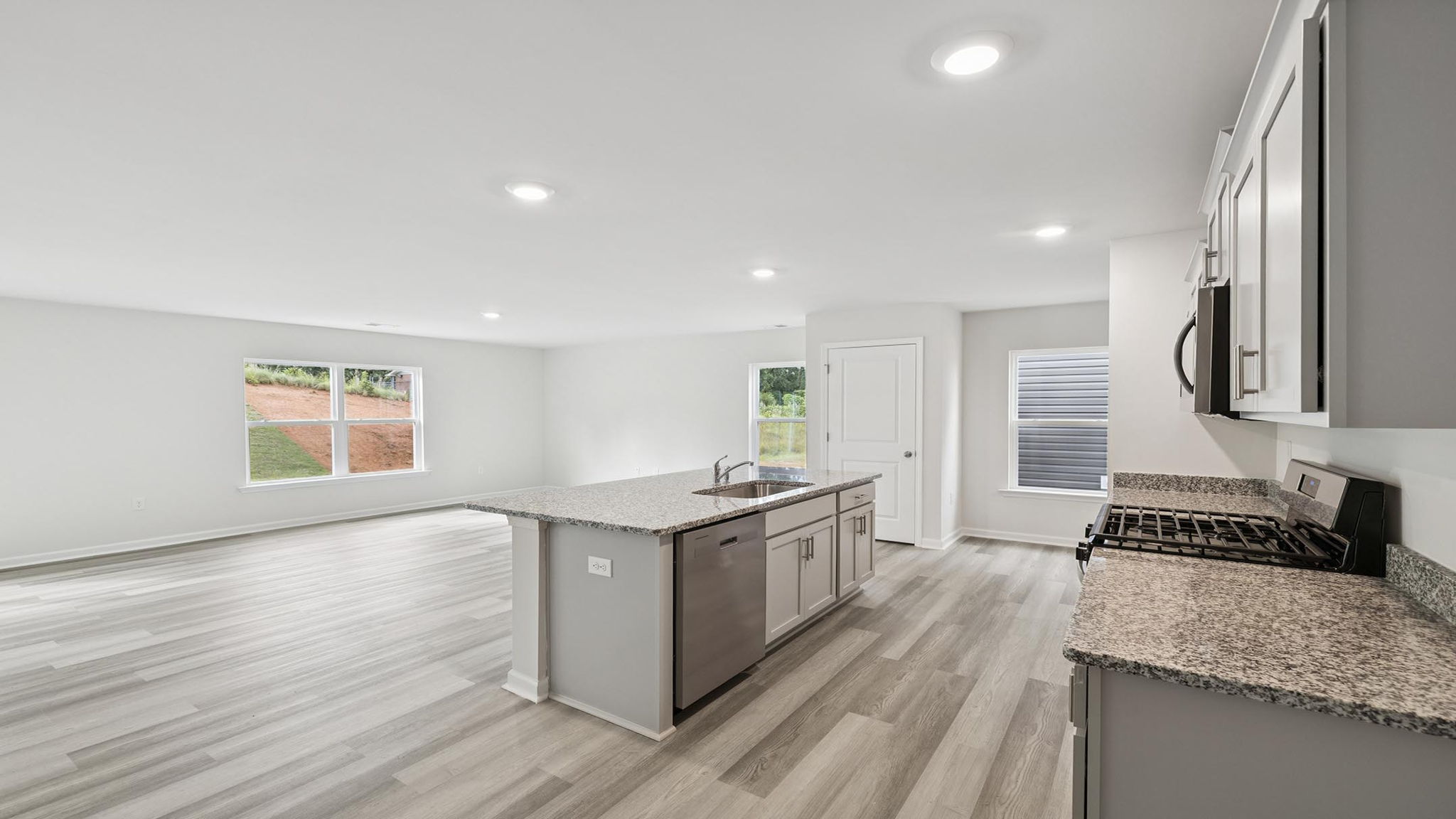 Kitchen with countertops and island.