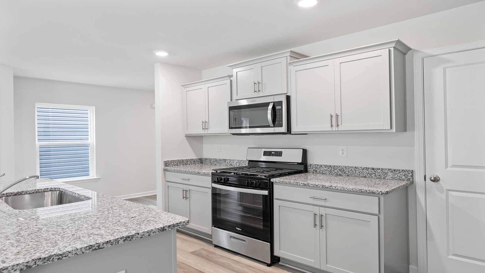 Kitchen with countertops and island.