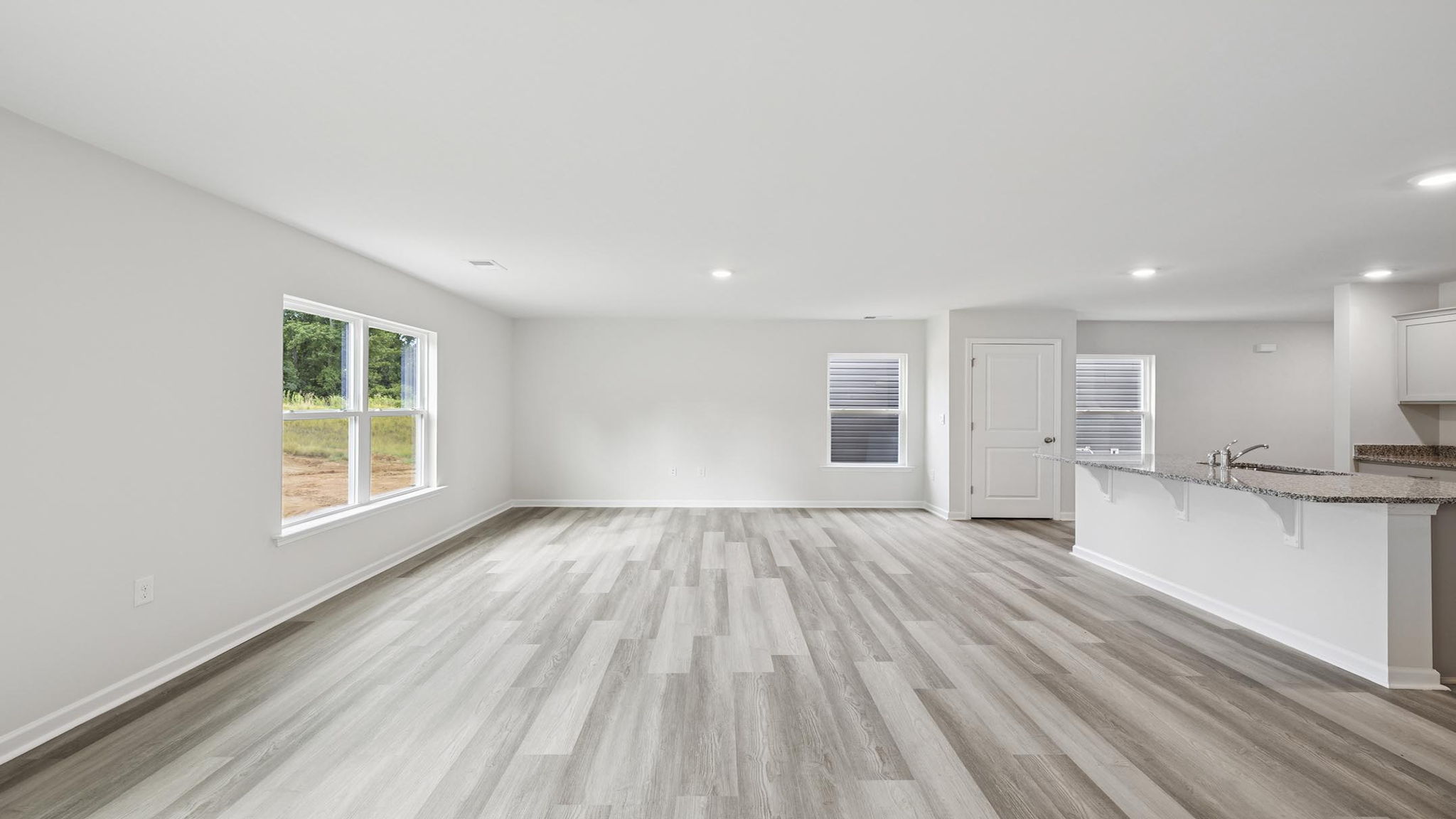 Livingroom and dining room with windows.