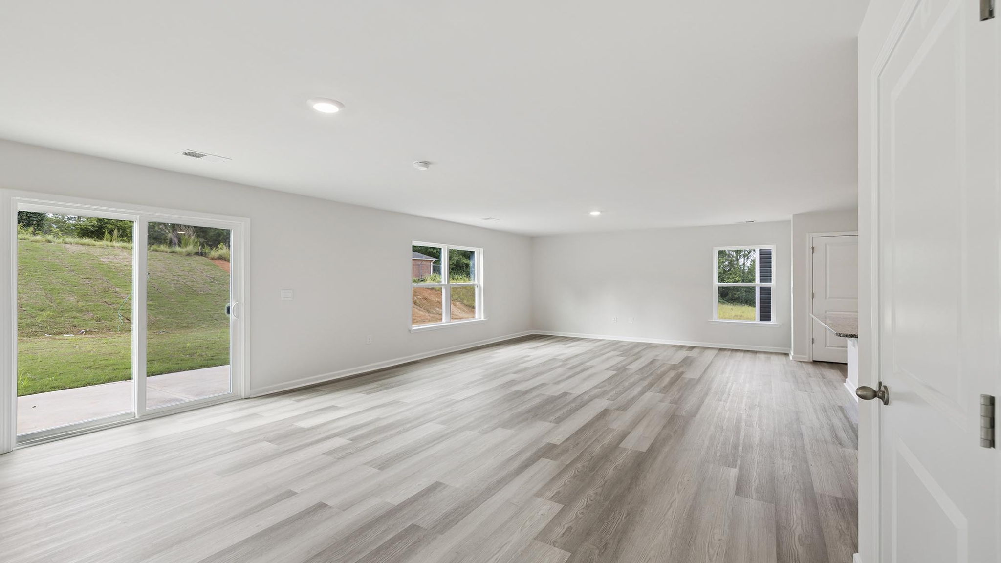 Livingroom and dining room with windows.