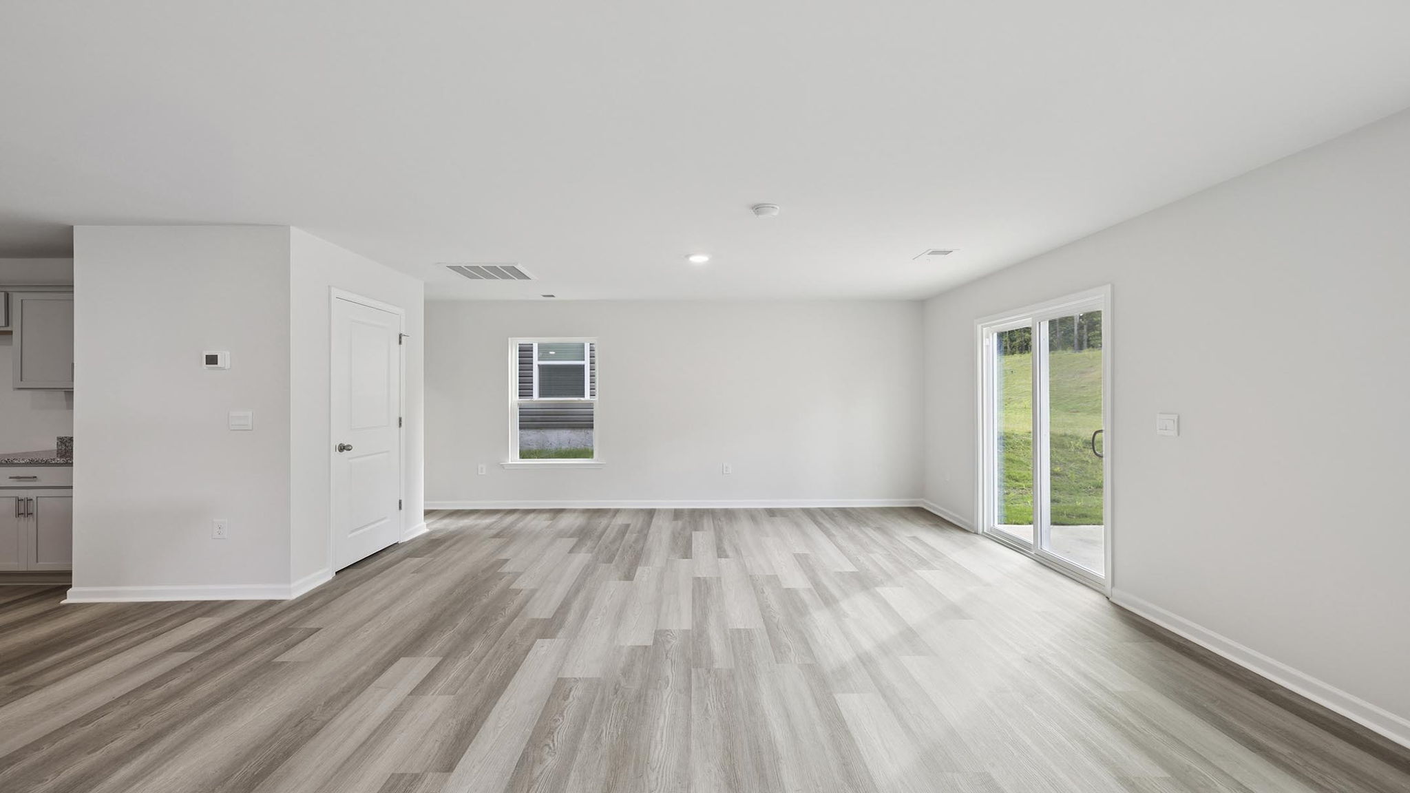 Livingroom and dining room with windows.
