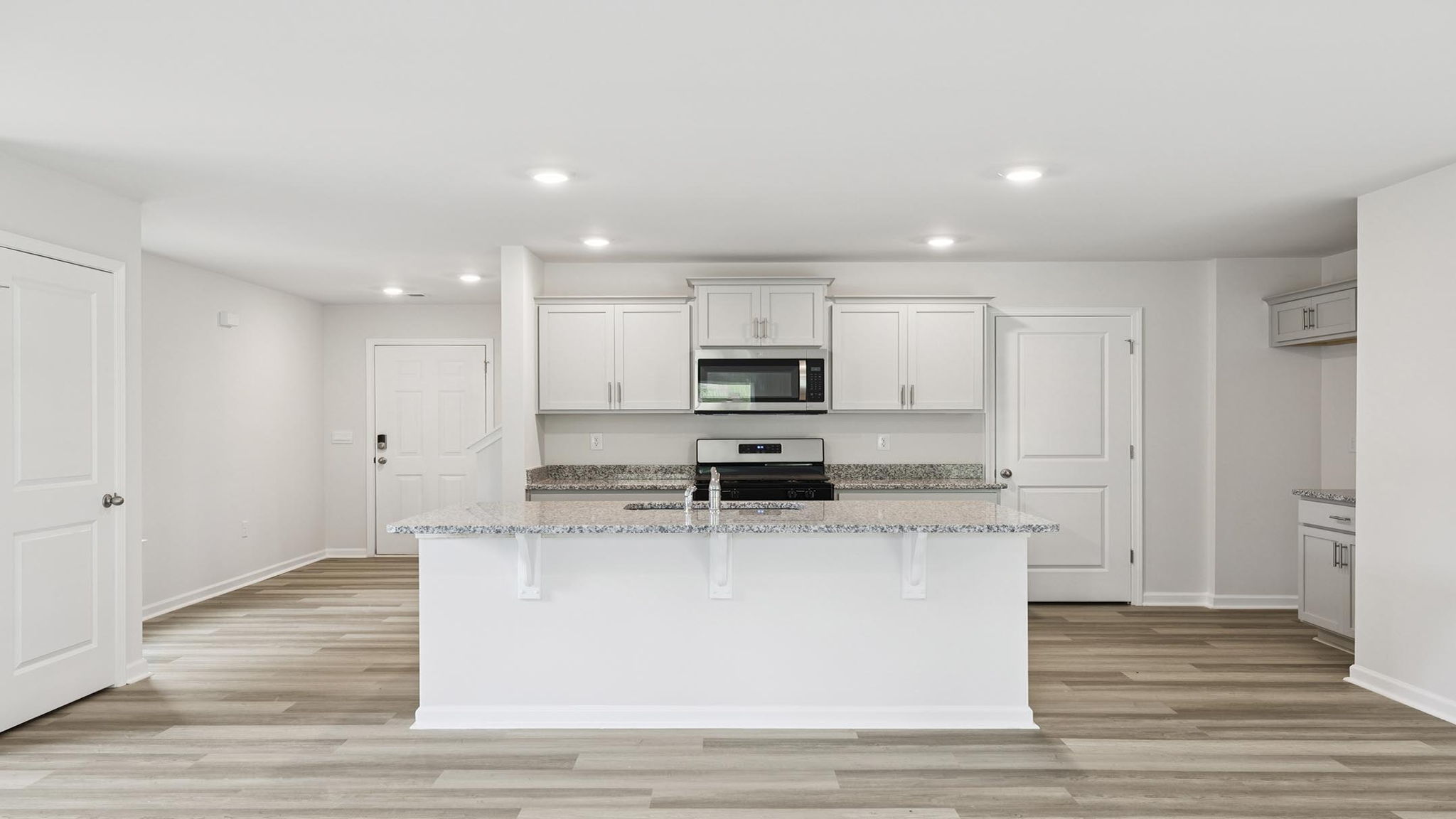 Kitchen with countertops and island.