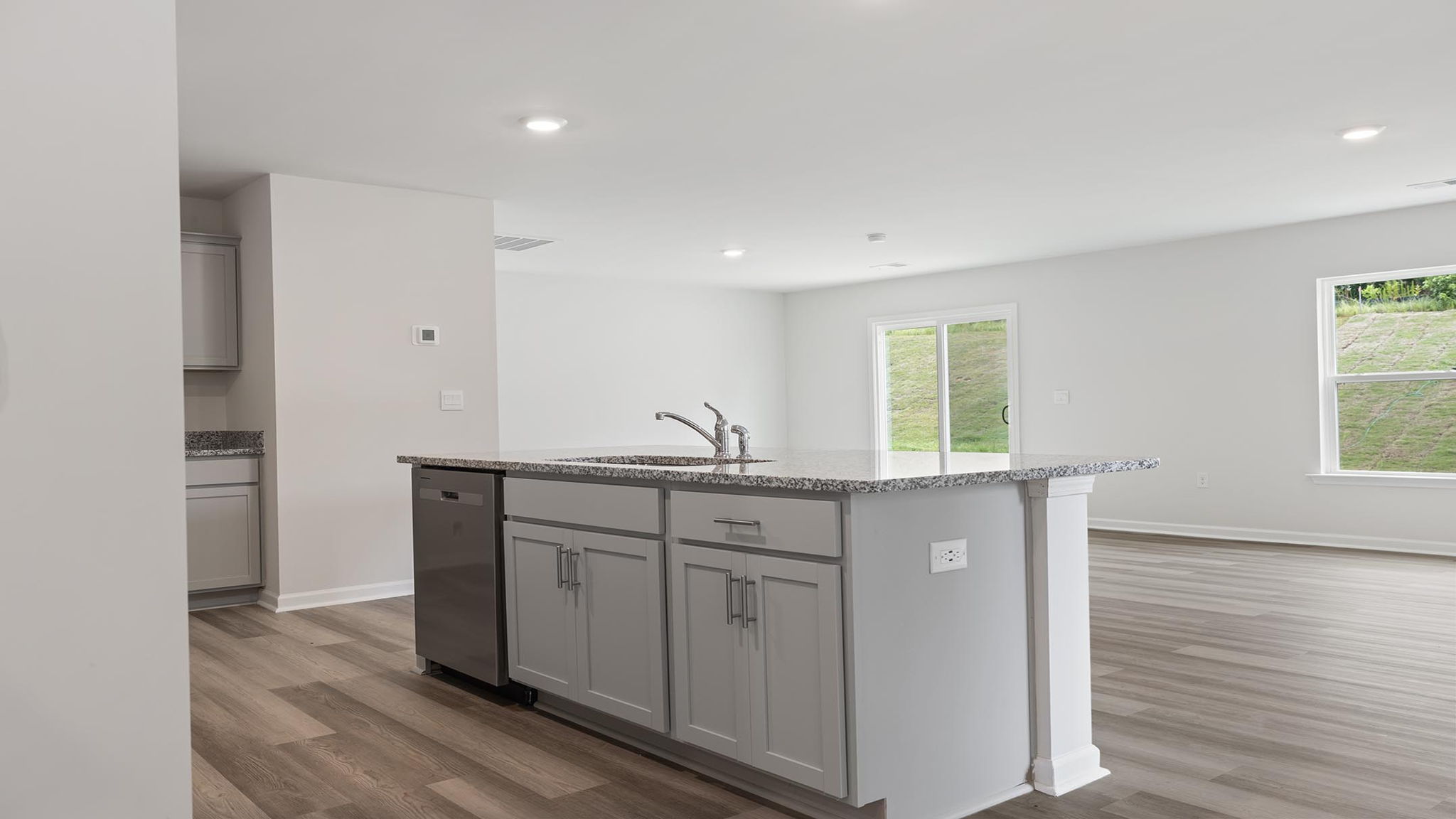 Kitchen with countertops and island.