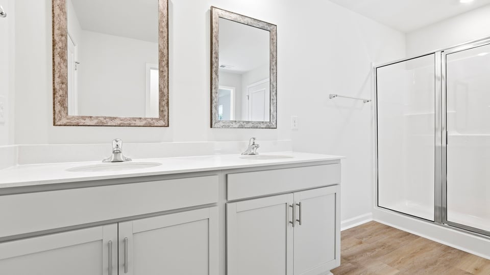 Primary bathroom with double vanity sinks.