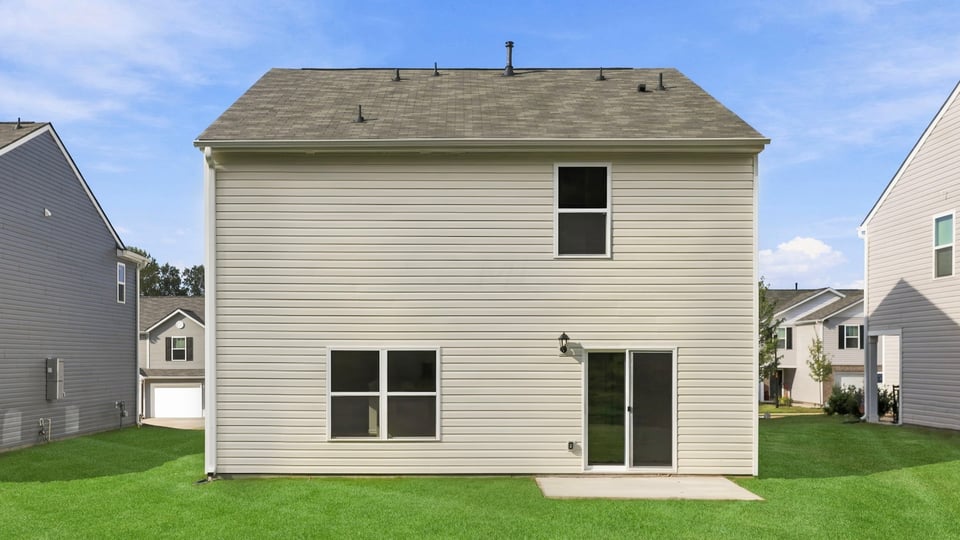 Back exterior with large backyard.
