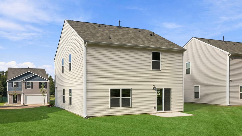 Back exterior with large backyard.