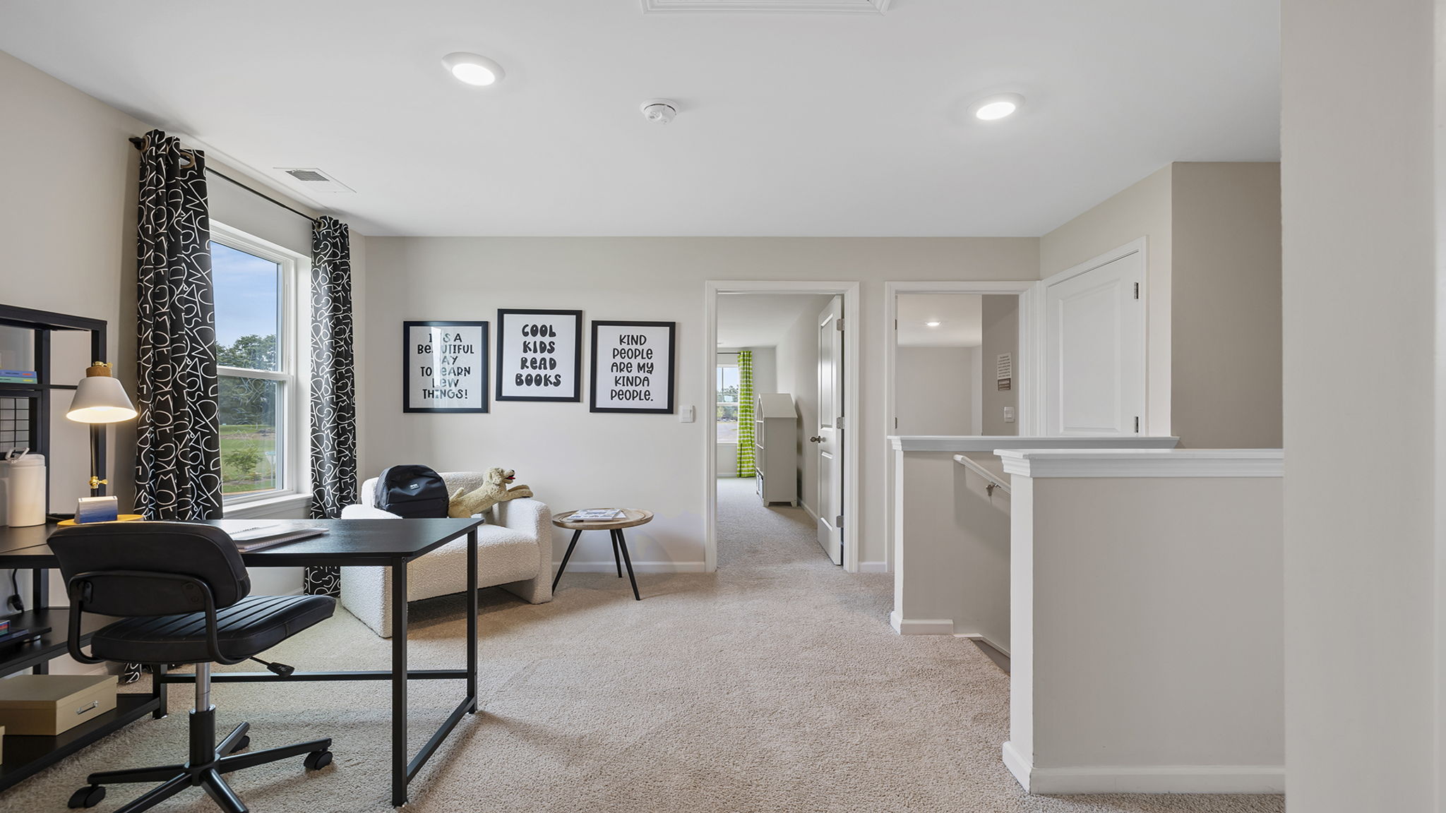 Loft area with carpet and window.