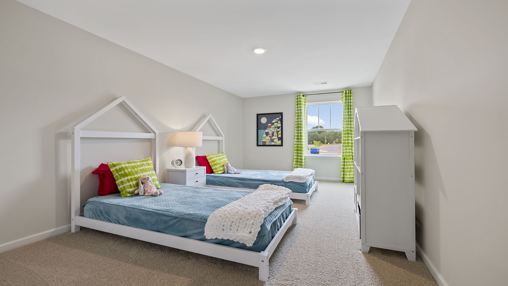 Bedroom with carpet and window.